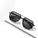 Elegant Grey Sigma sunglasses on angled surface