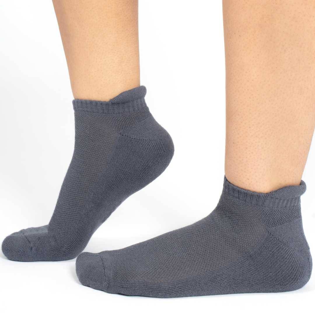 Dark blue bamboo socks on feet, side view