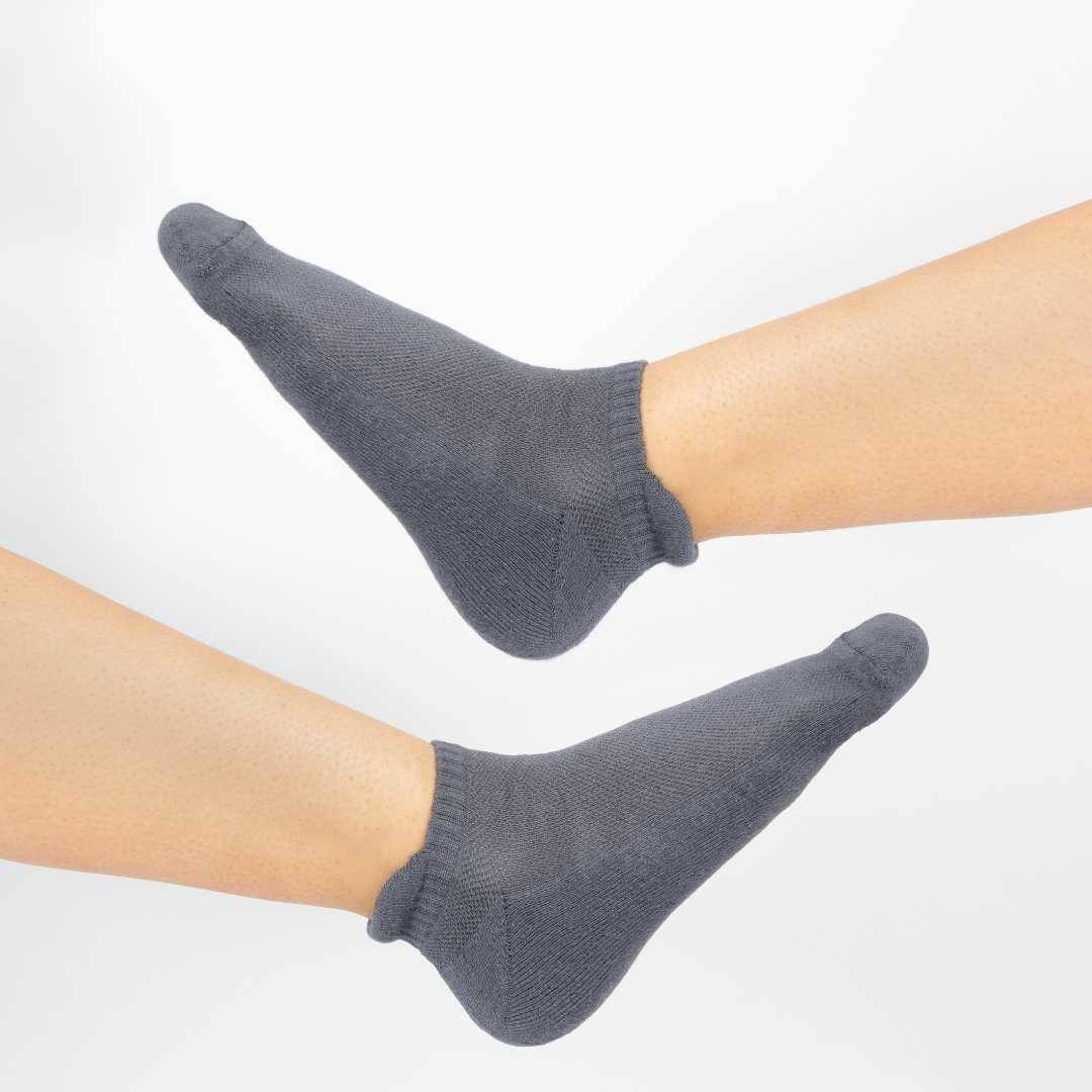 Dark blue bamboo socks on raised feet