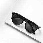 Ashura Dark Shade sunglasses on white surface