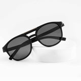 Ashura Dark Shade sunglasses on white stand