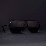 Black Sigma Dark Shade sunglasses on dark background