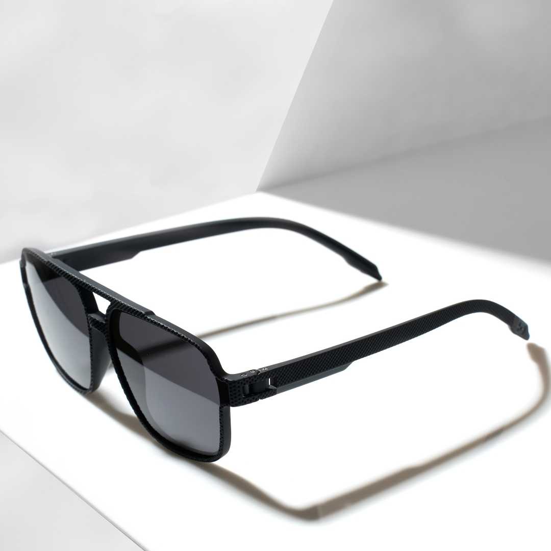 Sleek retro style sunglasses with dark lenses, angled view