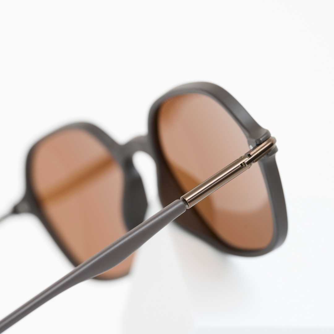 Close-up of dark brown sunglasses frame detail