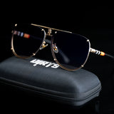 Chic gold blue sunglasses with dark lenses on black case