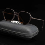 Dark brown sunglasses with dark lenses on case