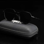 Dark black sunglasses on case, dark setting