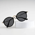 Infinity Iris Shade sunglasses on white stand