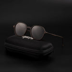 Dark brown sunglasses on black case