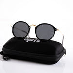 Infinity Iris Shade sunglasses displayed on case