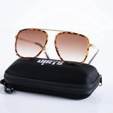 Tortoiseshell sunglasses on branded black case